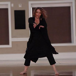 Adi Argov dancing in black dress