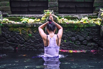 Image of a person holding his feet