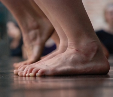 feet is in rest and another tip toeing