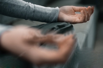 Image of a person holding his feet