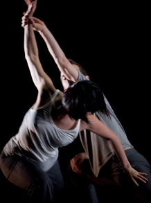 Image of a person holding his feet